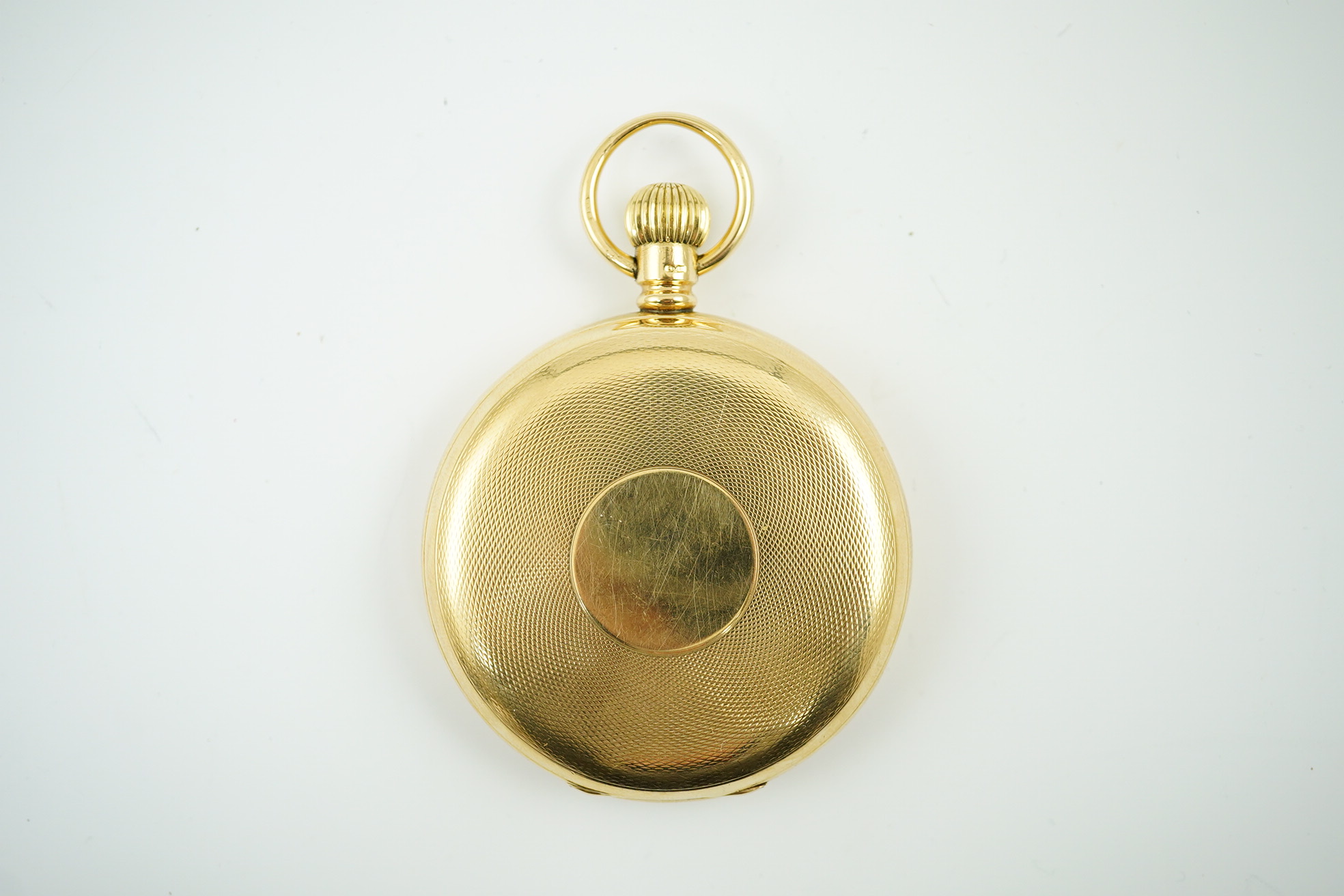 An Edwardian engine turned 18ct gold Waltham hunter keyless pocket watch